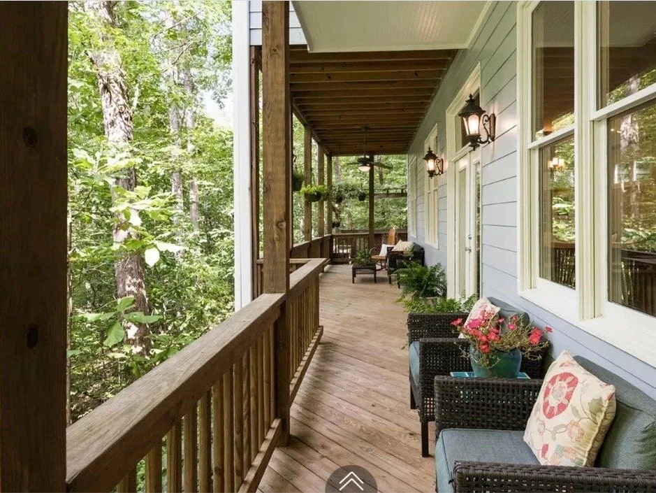Front porch styled with juniper planters and seating