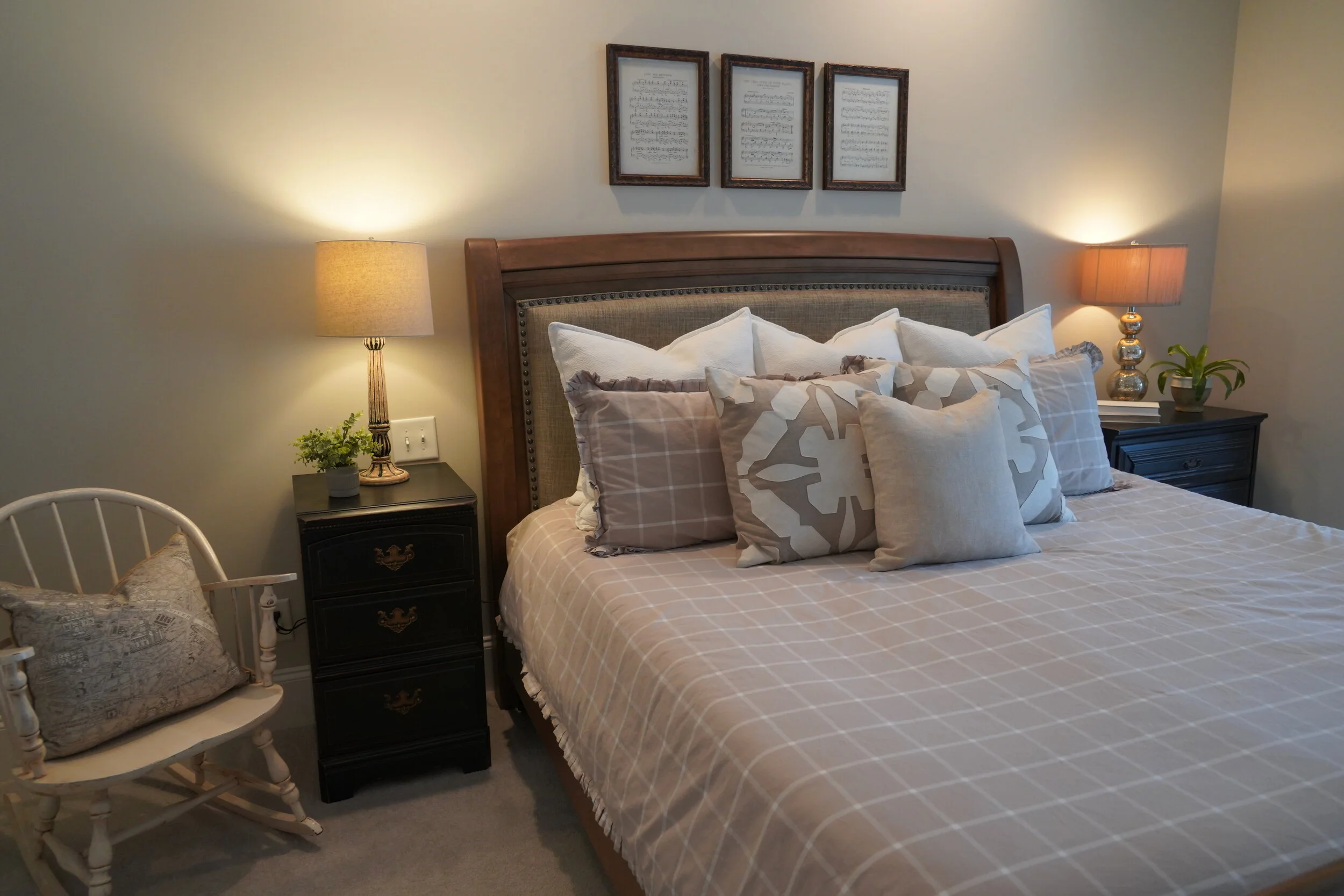 Primary bedroom styled with crisp bedding